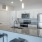 a kitchen with white cabinets