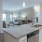a kitchen with a marble counter top