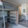 a studio apartment with a bunk bed