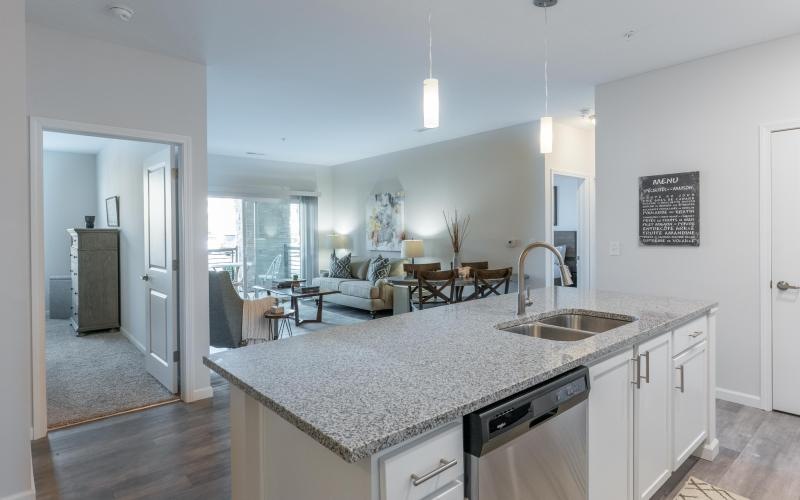 a kitchen with a marble counter top