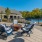 a patio with chairs and a table