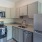 a kitchen with white cabinets