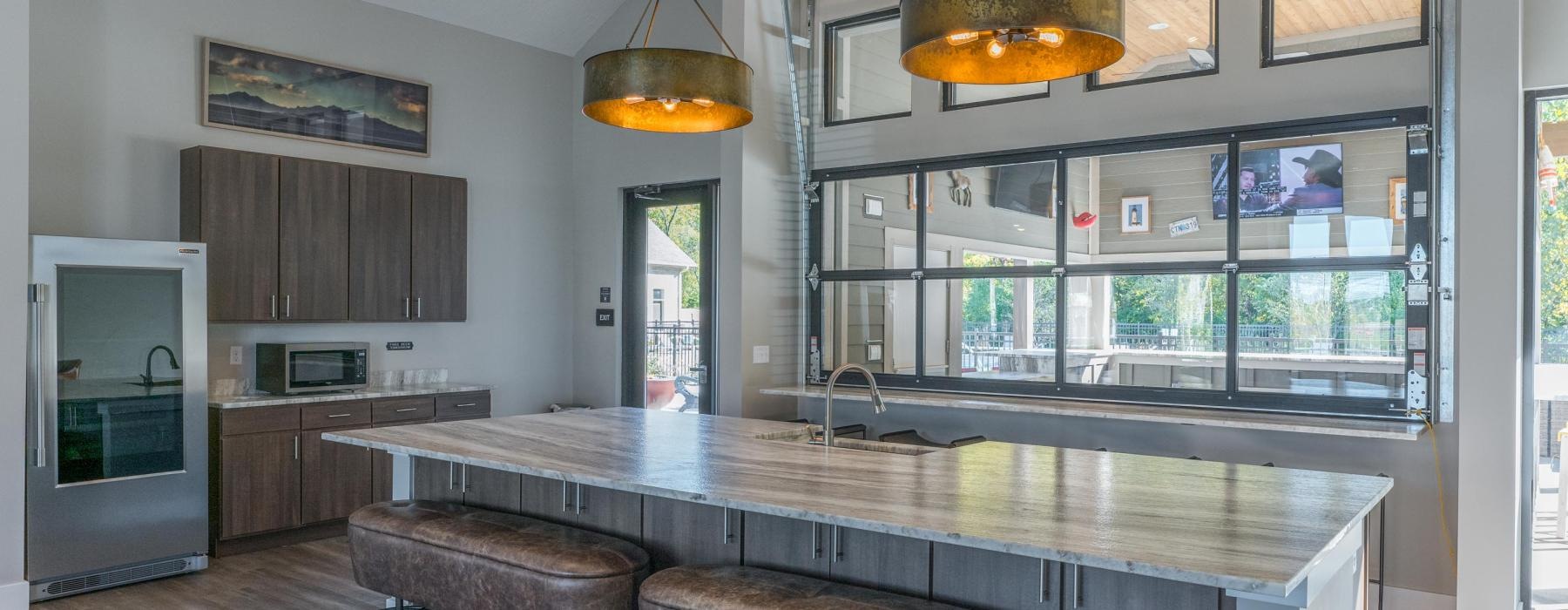 a kitchen with a bar and stools