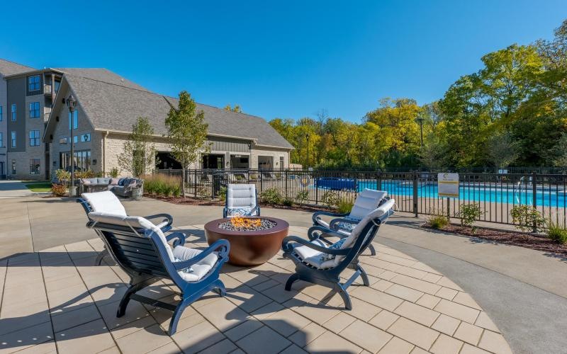 a patio with chairs and a table