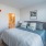 a bedroom with a bed and lamps